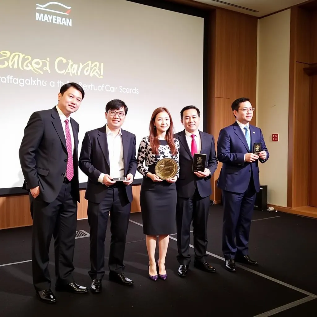 The ASEAN Car of the Year 2015 winners celebrating on the podium