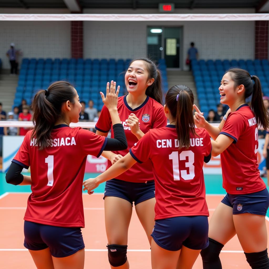 Players celebrating a point during the ASEAN School Games volleyball match